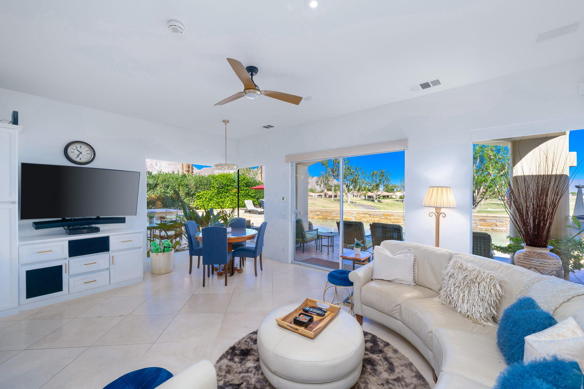 80128 Riviera La Quinta, CA 92253 - Photo 10 of 33 a living room with furniture a rug and a flat screen tv