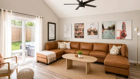 a living room with furniture and a window