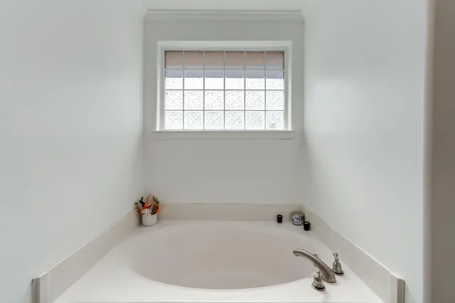 a white bath tub sitting in a bathroom