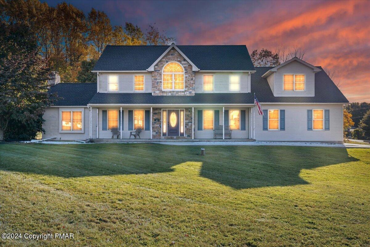 439 5 Points Richmond Road Bangor, PA 18013 - Photo 1 of 50 a front view of a house with a yard table and chairs