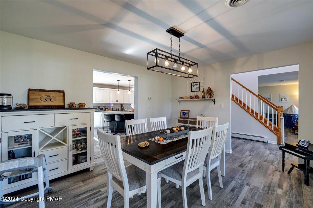 439 5 Points Richmond Road Bangor, PA 18013 - Photo 19 of 50 a kitchen with stainless steel appliances kitchen island granite countertop a table chairs and a refrigerator