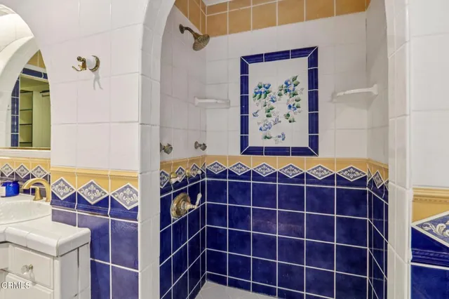 a kitchen with a dining table chairs stainless steel appliances and cabinets