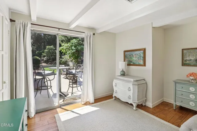a living room with furniture and large windows
