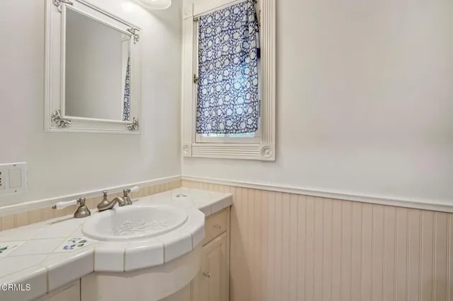 a view of a roof deck with wooden floor and fence