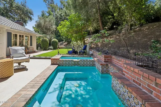 a view of backyard with a table and chairs