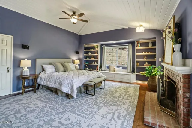 a bed room with a bed window and a fireplace