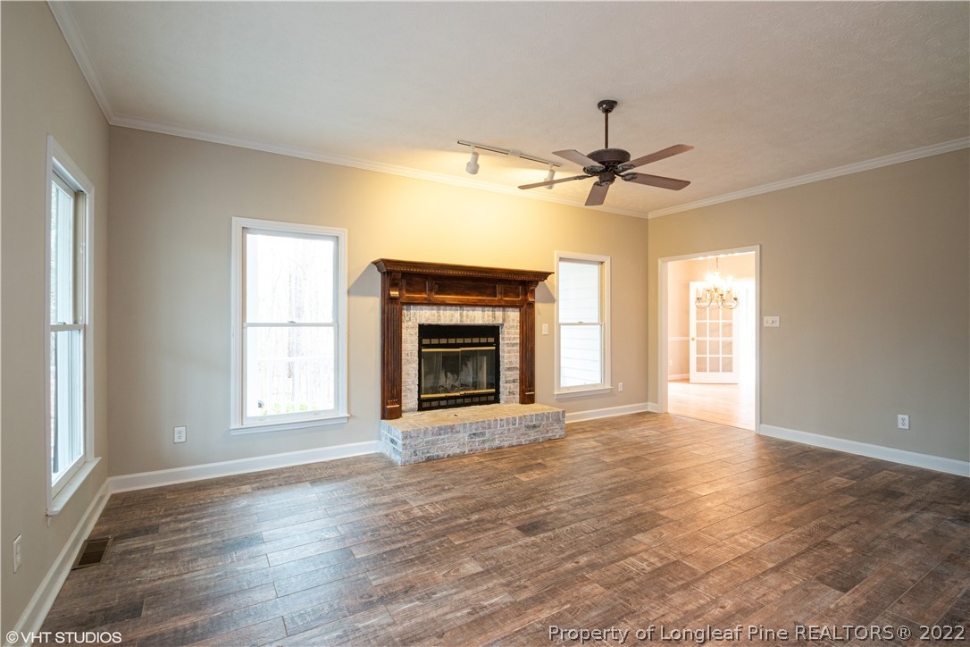 175 Lakeshore Drive Rockingham, NC 28379 - Photo 6 of 25 a view of an empty room with a window and a kitchen