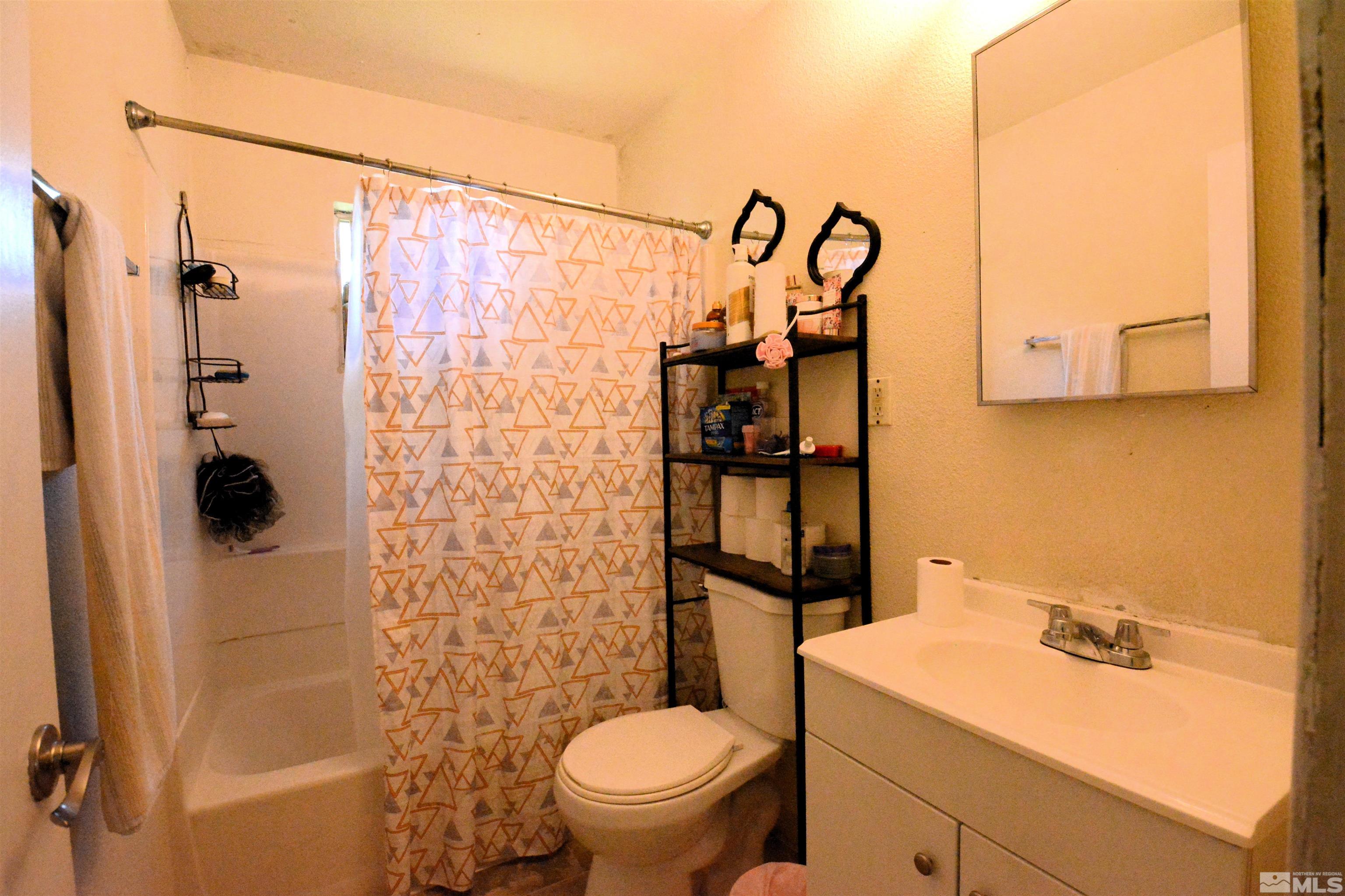 1930 Trainer Way Reno, NV 89512 - Photo 12 of 24 a bathroom with a shower toilet and sink