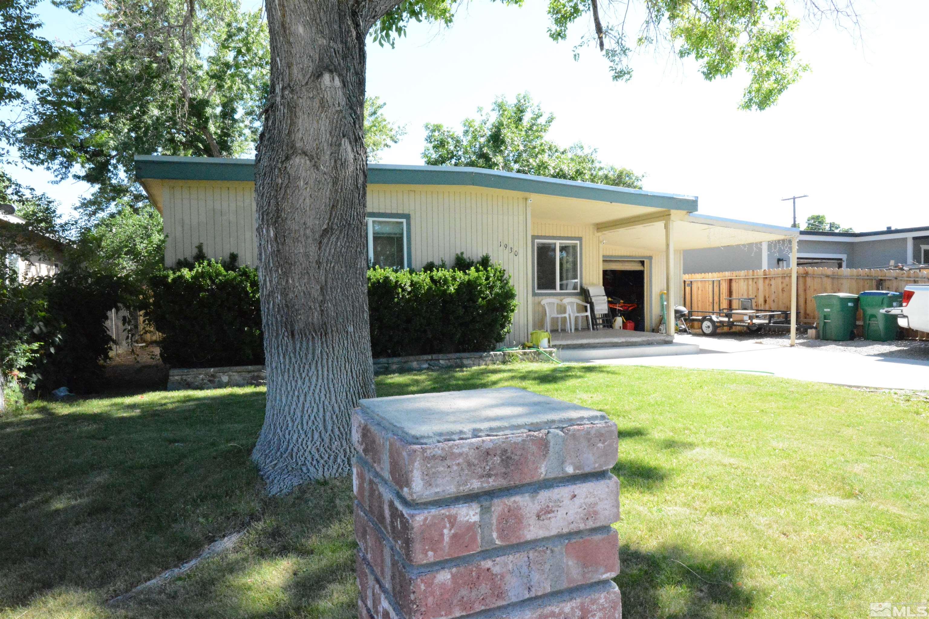 1930 Trainer Way Reno, NV 89512 - Photo 23 of 24 a view of a house with backyard and a tree