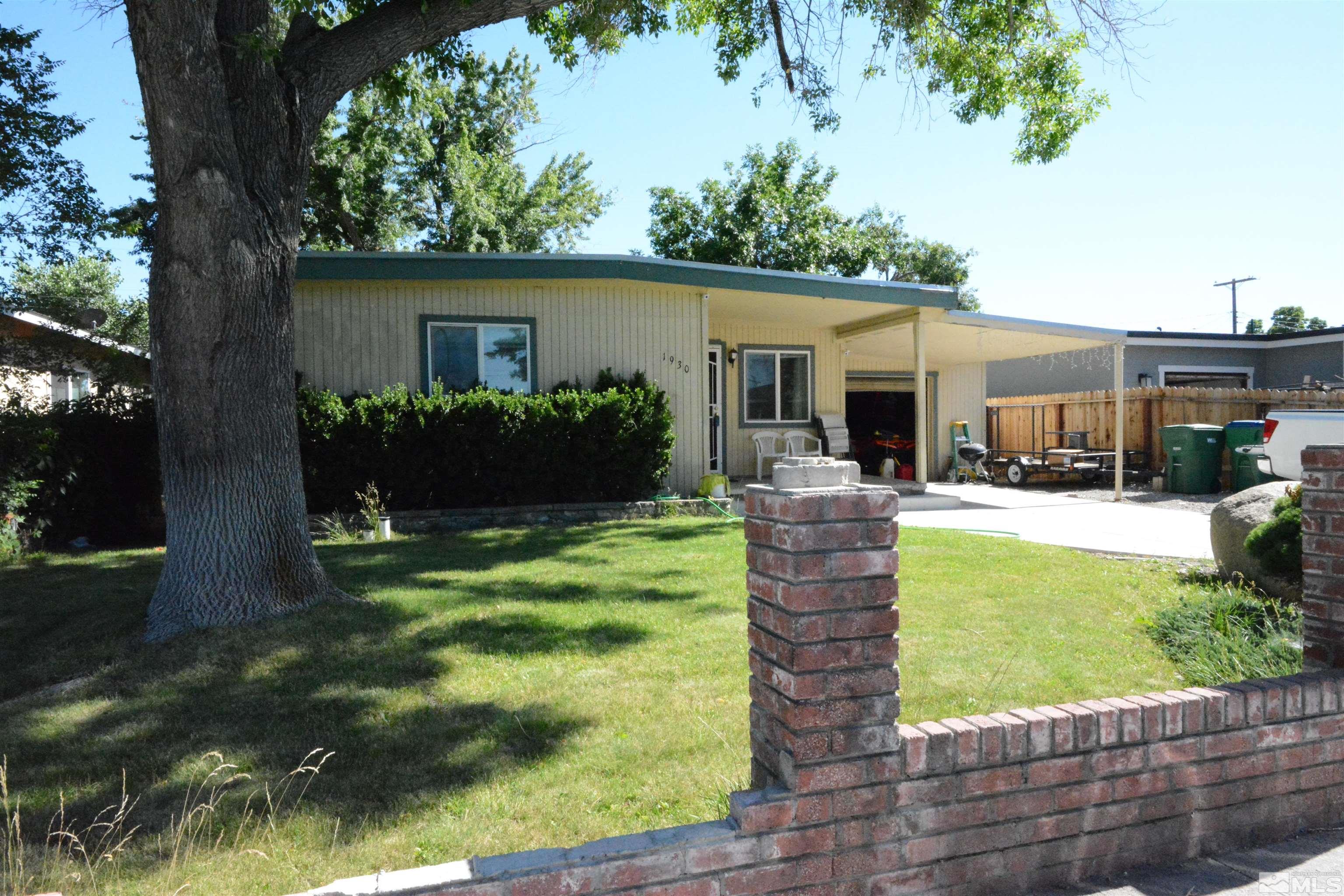 1930 Trainer Way Reno, NV 89512 - Photo 24 of 24 a front view of house with a garden and patio
