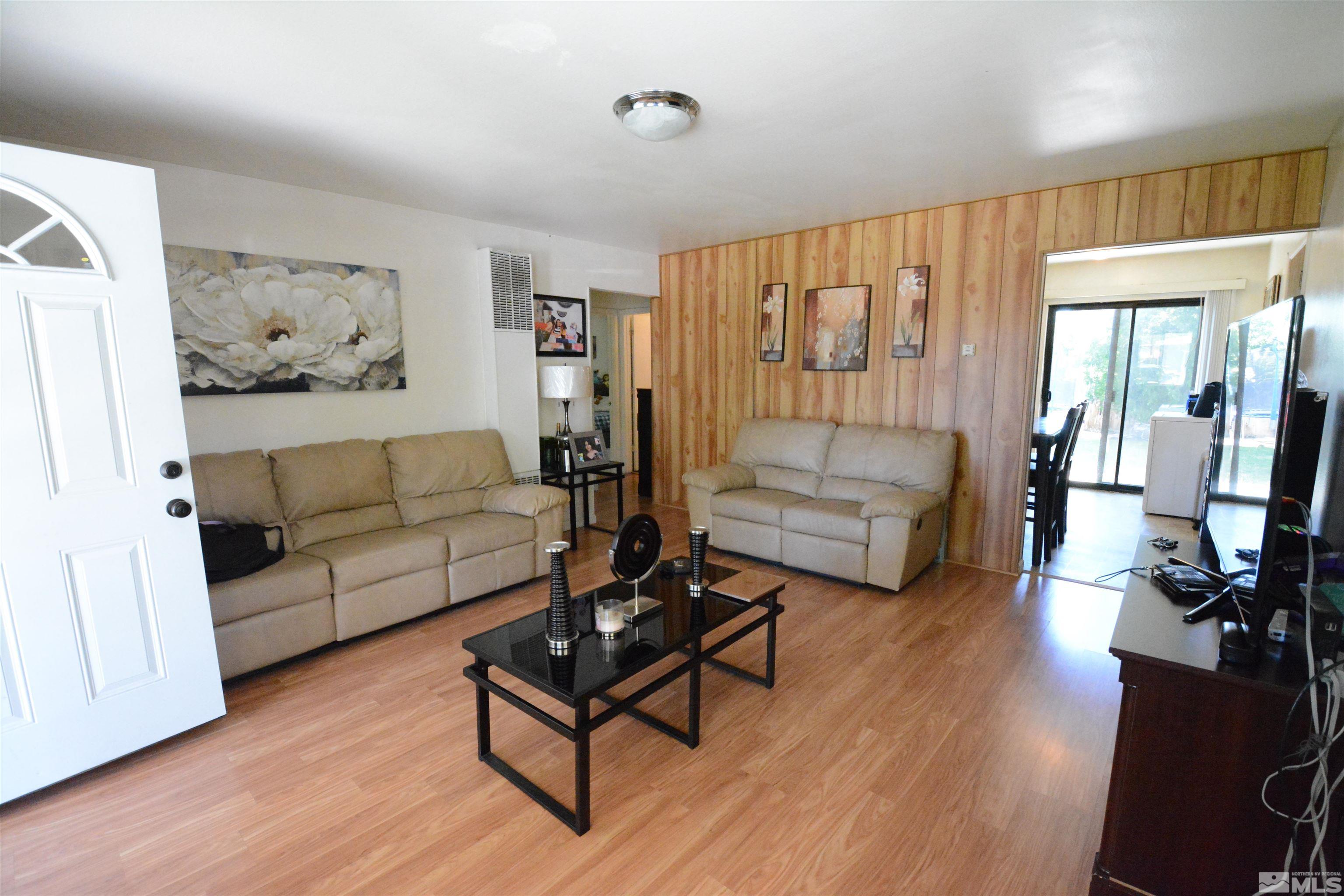 1930 Trainer Way Reno, NV 89512 - Photo 3 of 24 a living room with furniture and a large window