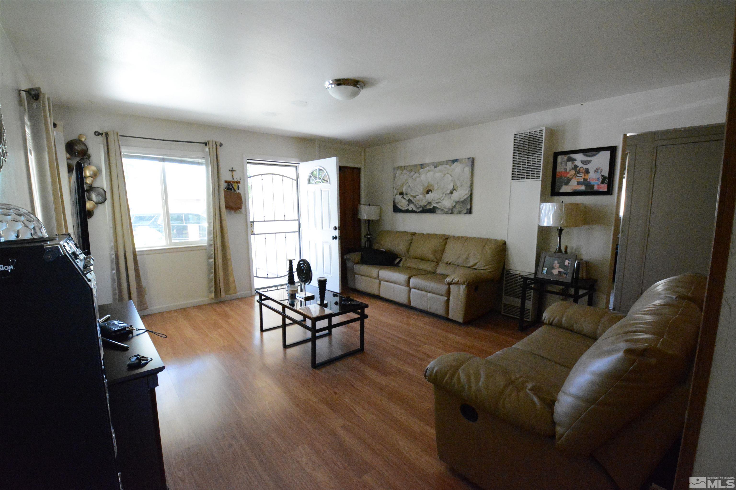 1930 Trainer Way Reno, NV 89512 - Photo 4 of 24 a living room with furniture and a flat screen tv