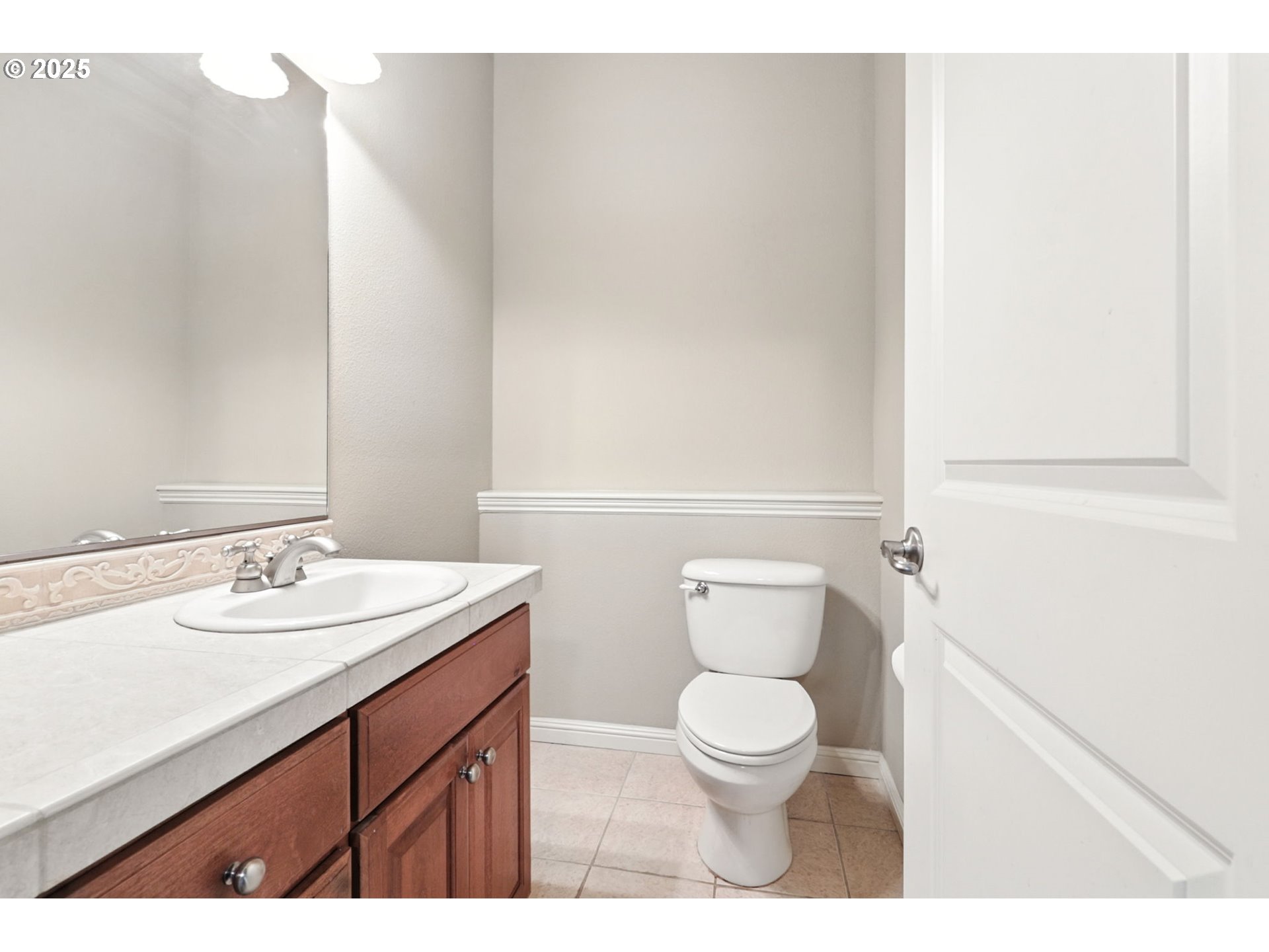 2052 Northwest Fargo Loop Camas, WA 98607 - Photo 27 of 44 a bathroom with a toilet a sink and a mirror