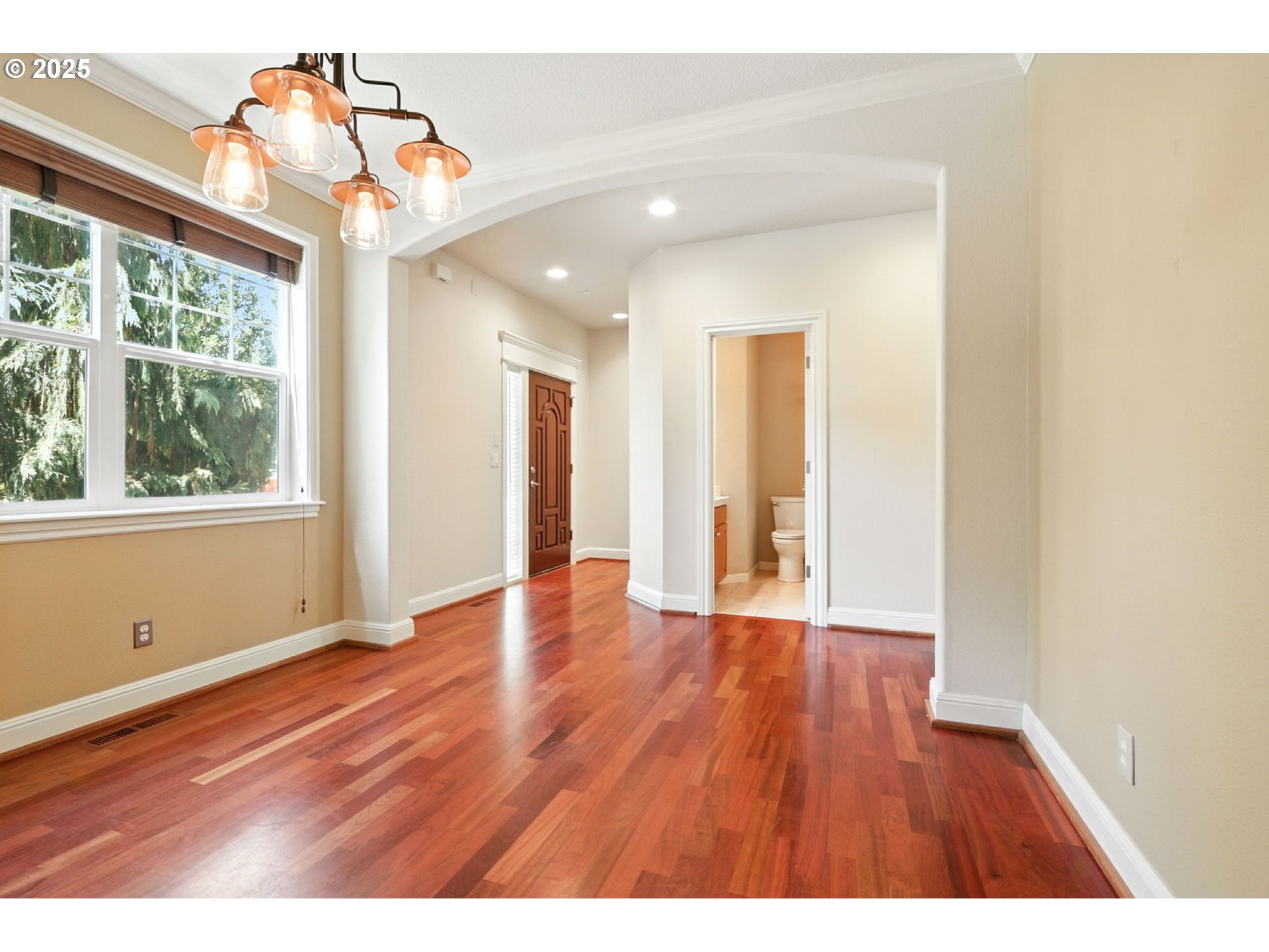 2052 Northwest Fargo Loop Camas, WA 98607 - Photo 5 of 44 a view of an empty room with wooden floor and a window