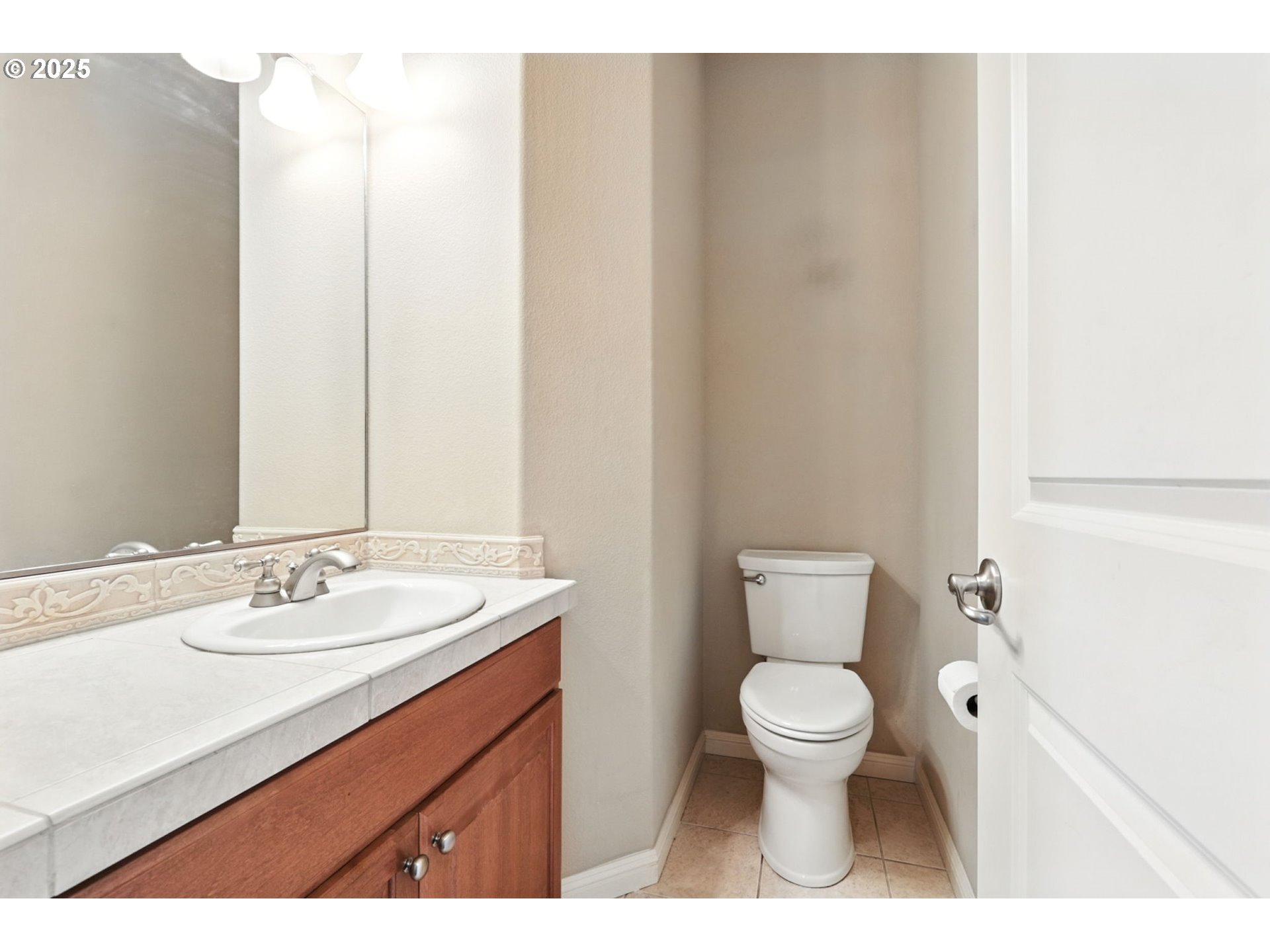 2052 Northwest Fargo Loop Camas, WA 98607 - Photo 7 of 44 a bathroom with a sink a toilet and a mirror