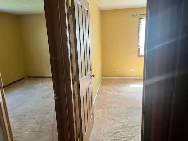a view of an empty room with entrance