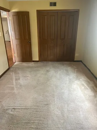 an empty room with a windows