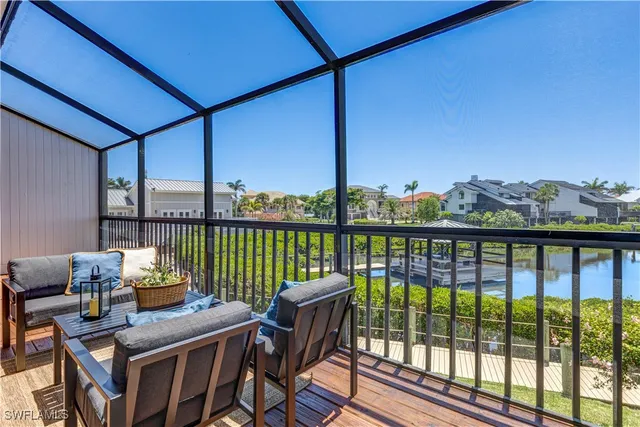a balcony with furniture and city view