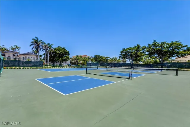 a living room with furniture dining table and a wooden floor