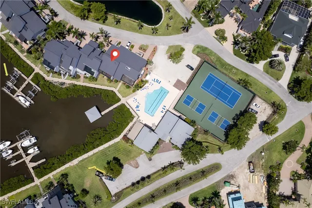 an aerial view of a house with a ocean view