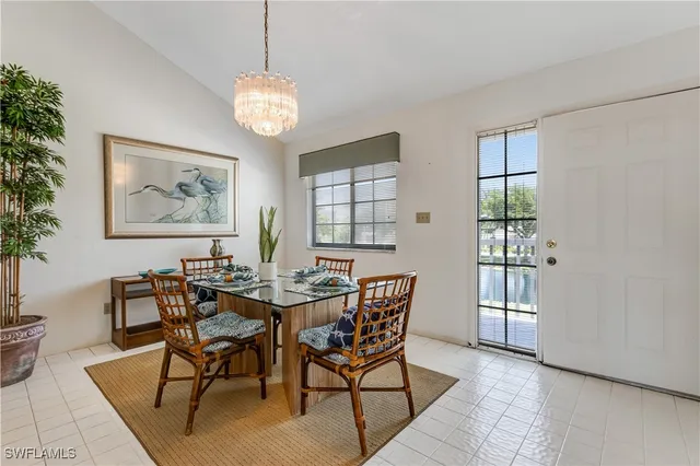 a view of a dining room with furniture and window