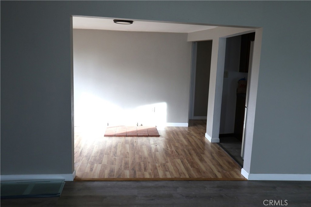 1410 4th Corning, CA 96021 - Photo 11 of 26 a view of empty room with wooden floor