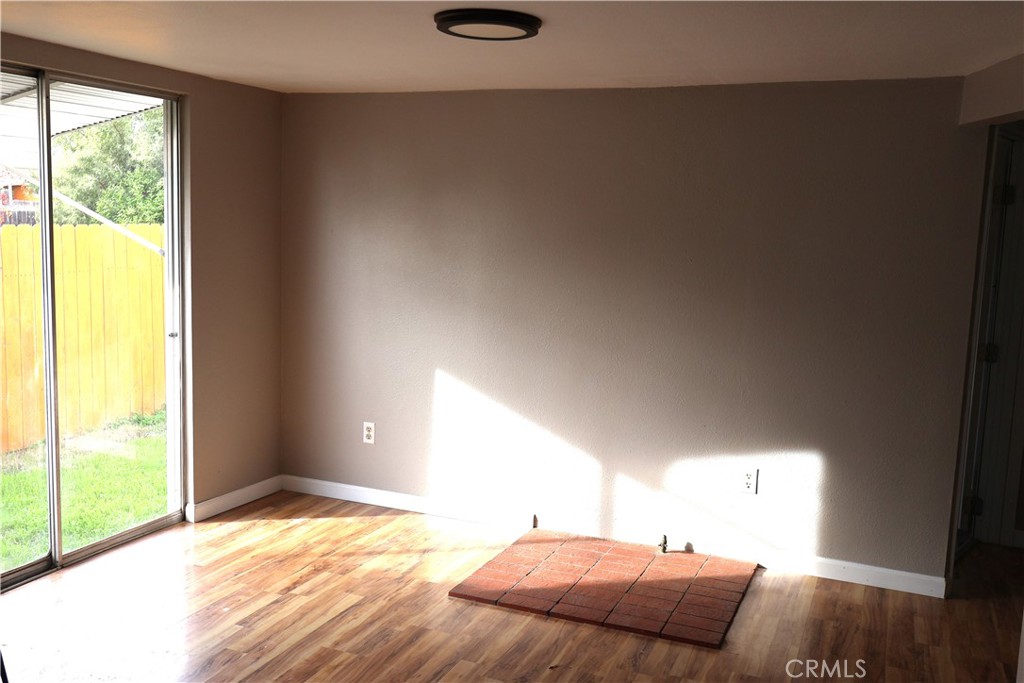 1410 4th Corning, CA 96021 - Photo 14 of 26 a bedroom with a bed and a window