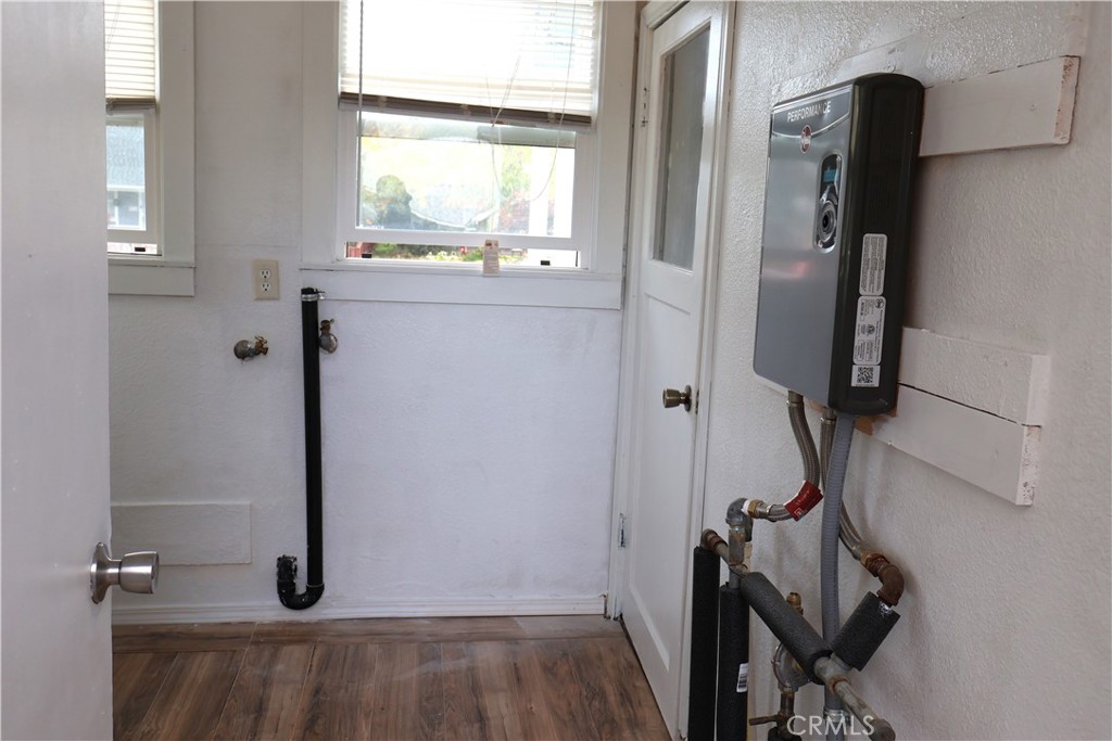 1410 4th Corning, CA 96021 - Photo 19 of 26 a view of a hallway with wooden floor and a cabinet