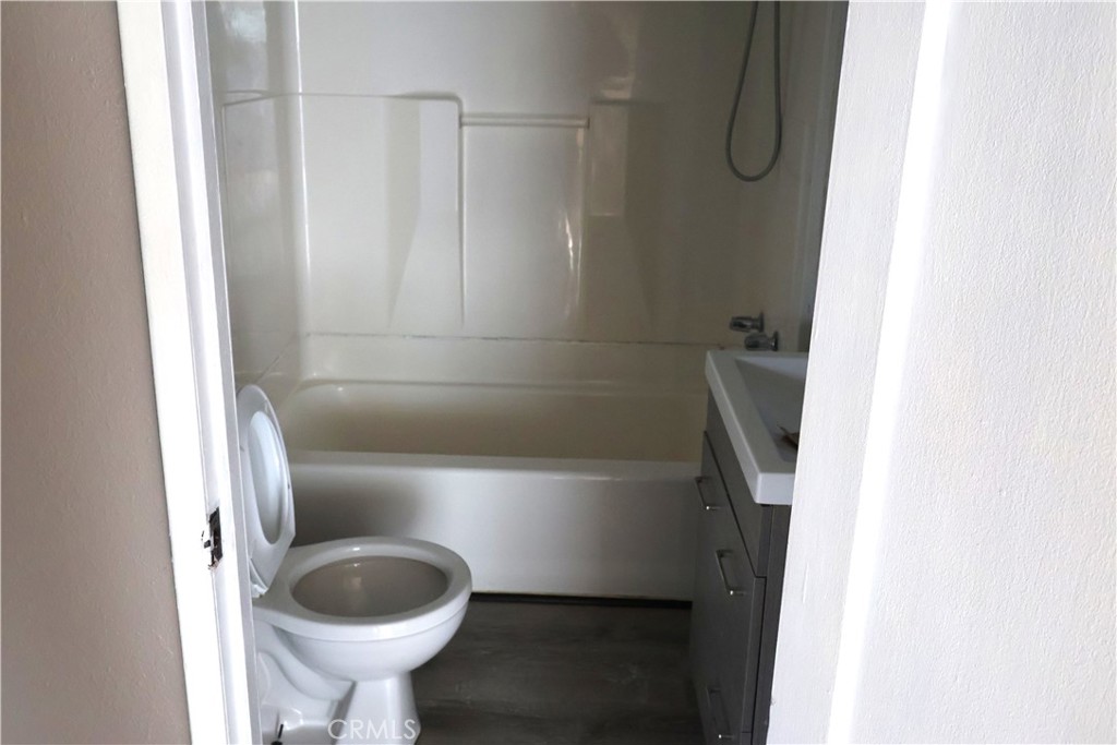 1410 4th Corning, CA 96021 - Photo 20 of 26 a bathroom with a sink toilet and shower