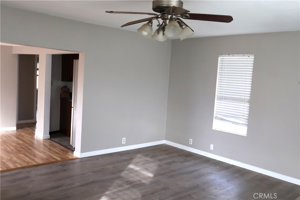 1410 4th Corning, CA 96021 - Photo 8 of 26 an empty room with wooden floor closet and windows