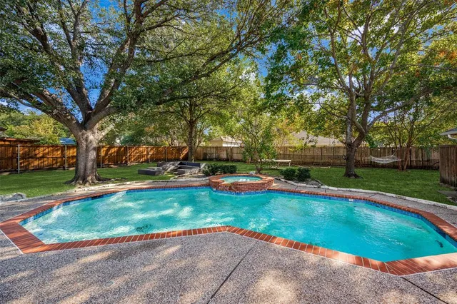 a view of a garden with swimming pool