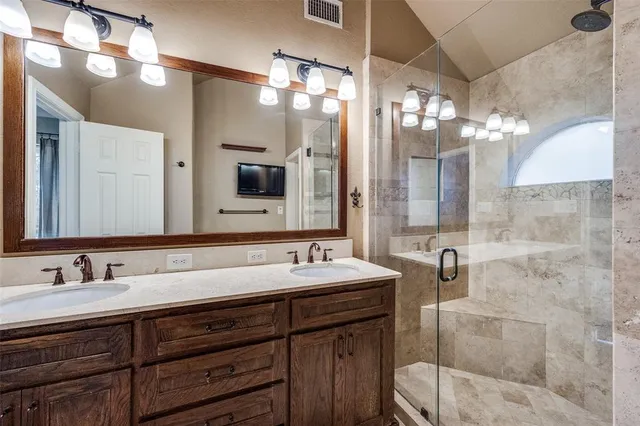 a bathroom with a double vanity sink mirror and double