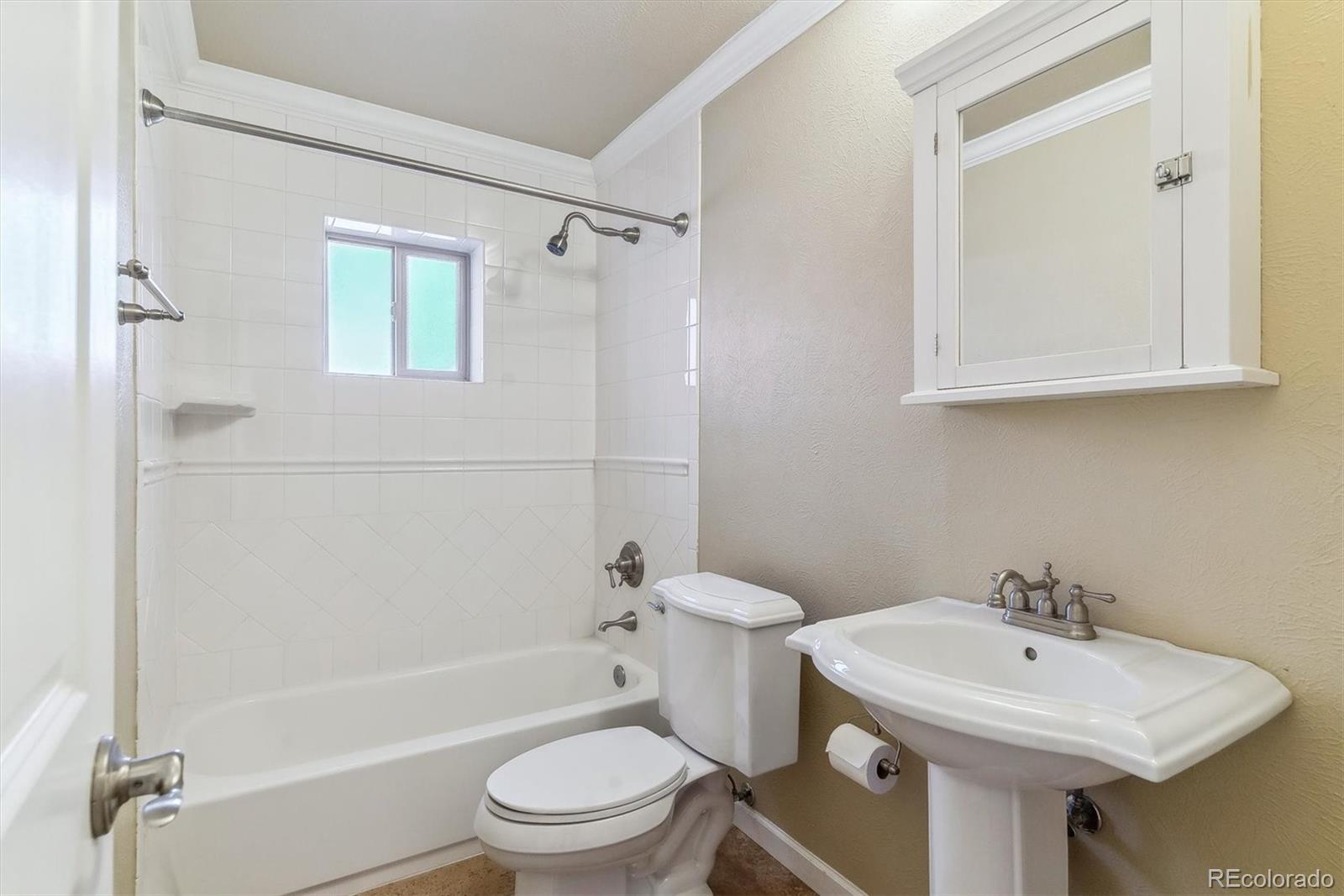 1330 Elizabeth Street, Unit 8 Denver, CO 80206 - Photo 11 of 15 a bathroom with a sink toilet and shower