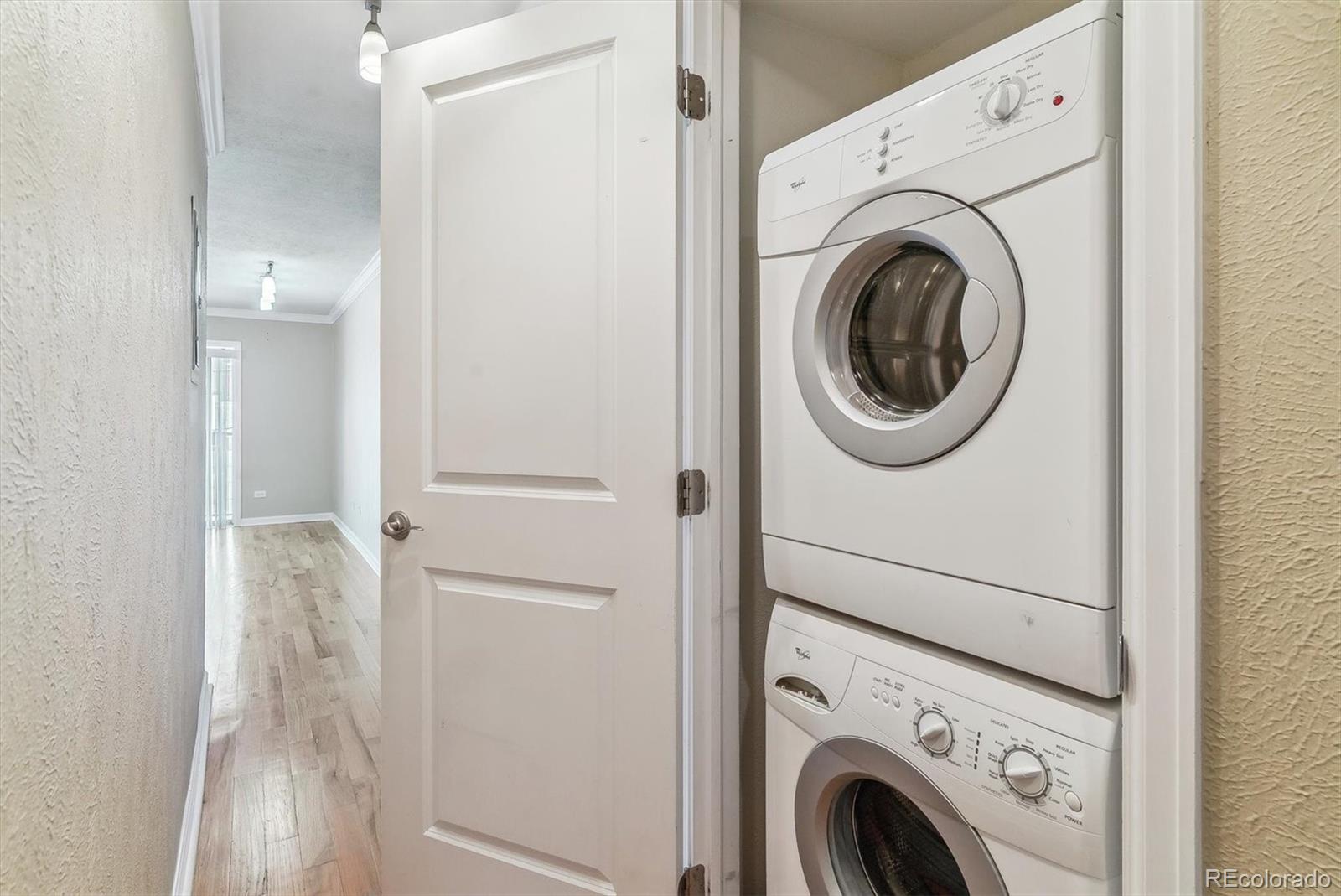 1330 Elizabeth Street, Unit 8 Denver, CO 80206 - Photo 10 of 15 a view of storage and utility room with washer and dryer