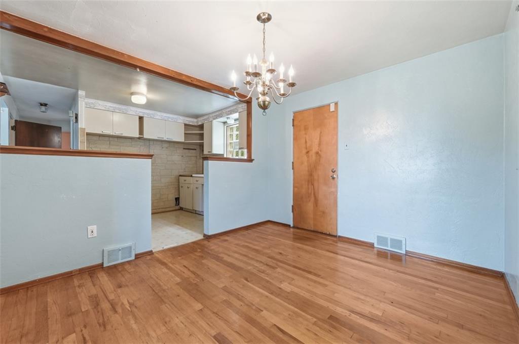 328 Ruthwood Avenue Pittsburgh, PA 15227 - Photo 6 of 32 a view of a room with wooden floor and chandelier