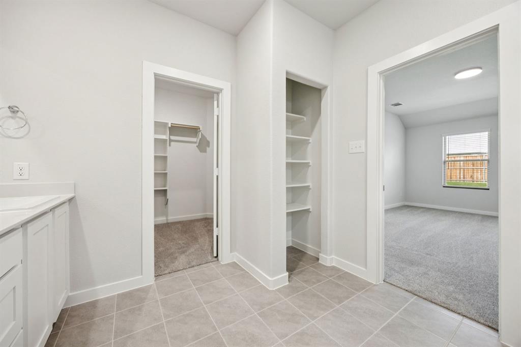 2112 Currents Road Princeton, TX 75407 - Photo 16 of 27 Primary Bathroom in the Emmy II home plan by Trophy Signature Homes - REPRESENTATIVE PHOTO
