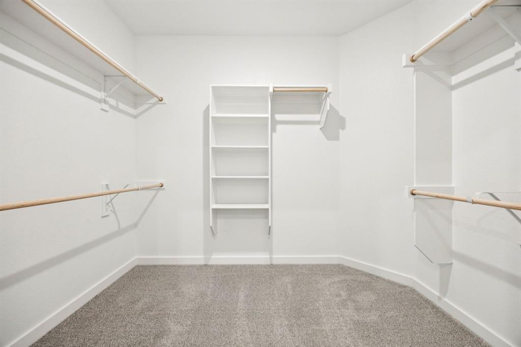 2112 Currents Road Princeton, TX 75407 - Photo 17 of 27 Primary Closet in the Emmy II home plan by Trophy Signature Homes - REPRESENTATIVE PHOTO