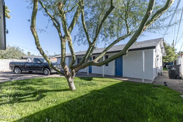 a view of a house with backyard porch and sitting area