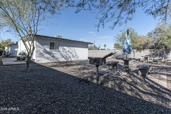 a view of a backyard of the house