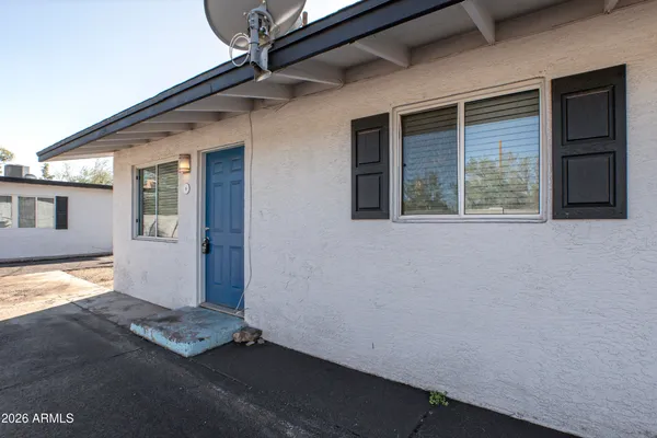 a view of a house with wooden floor and a window