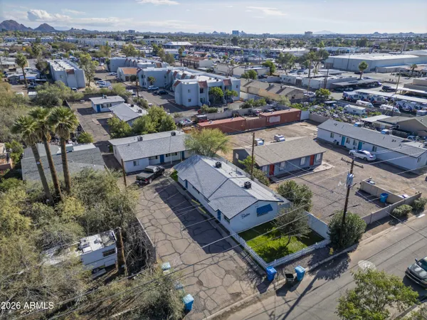 an aerial view of a house with a yard