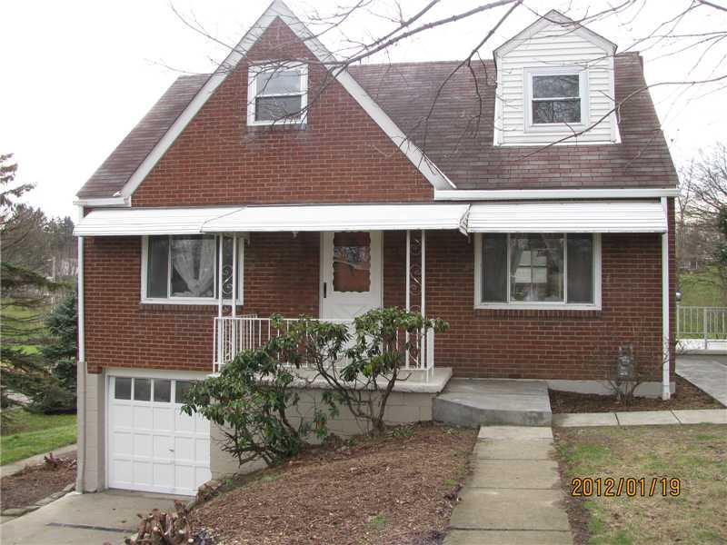7 West Calvin Drive McKees Rocks, PA 15136 - Photo 2 of 20 Exterior Front. The lower portion of the home has been painted along with the garage door. All of the railings and porches were also painted.