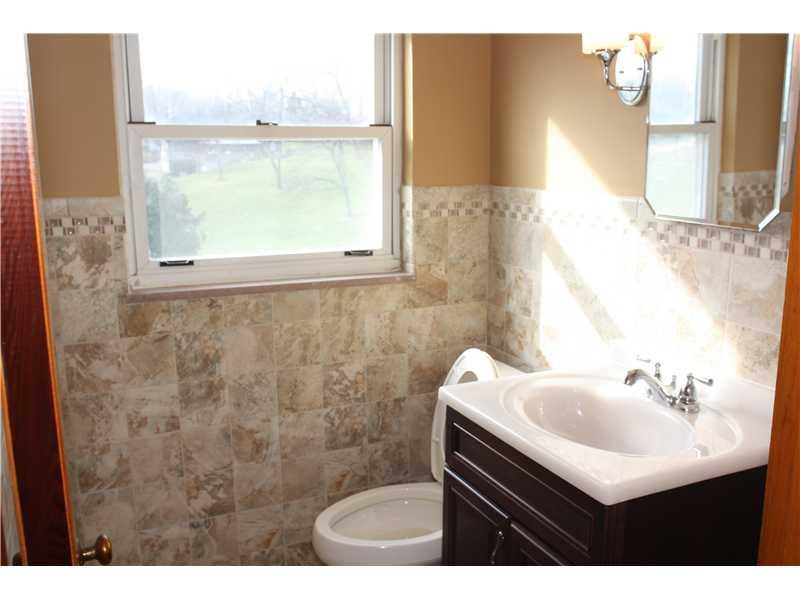 7 West Calvin Drive McKees Rocks, PA 15136 - Photo 17 of 20 Partial Bath. Partial bath on upper level. Everything is new! Gorgeous tile work!!