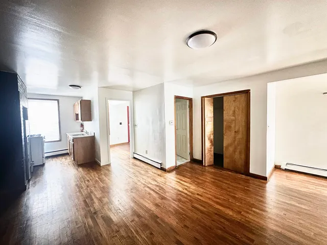 a view of a livingroom with wooden floor