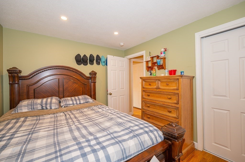 4 Kent Street Clinton, MA 01510 - Photo 18 of 39 a bedroom with a bed and a dresser