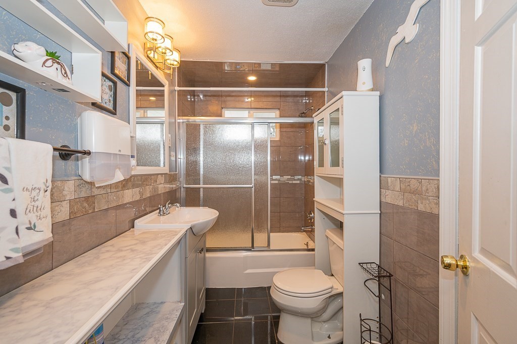 4 Kent Street Clinton, MA 01510 - Photo 19 of 39 a bathroom with a sink toilet and shower