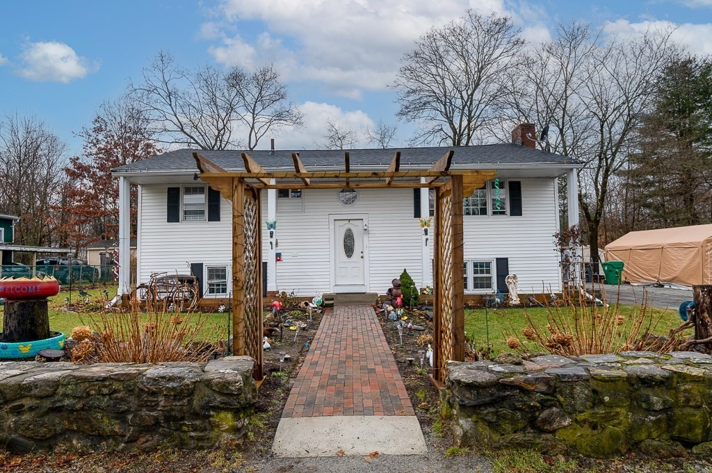 4 Kent Street Clinton, MA 01510 - Photo 2 of 39 a front view of a house with garden