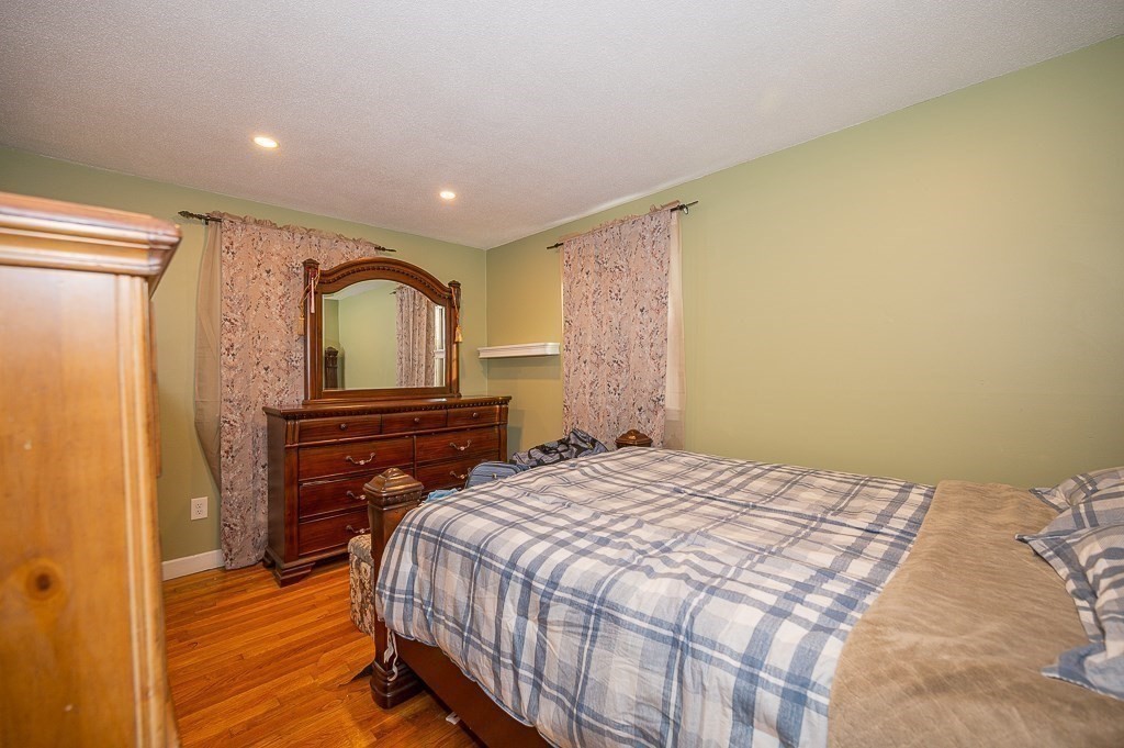 4 Kent Street Clinton, MA 01510 - Photo 21 of 39 a bedroom with a bed and a dresser