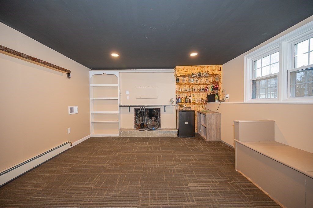 4 Kent Street Clinton, MA 01510 - Photo 26 of 39 a view of a big room with windows and fireplace