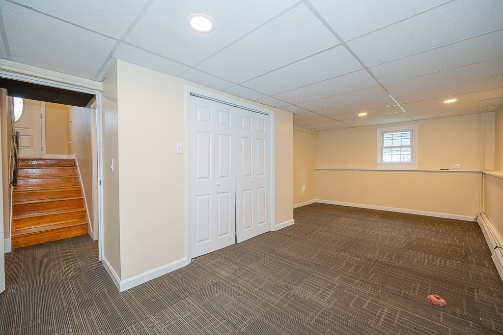 4 Kent Street Clinton, MA 01510 - Photo 29 of 39 a view of an empty room with wooden floor and a window